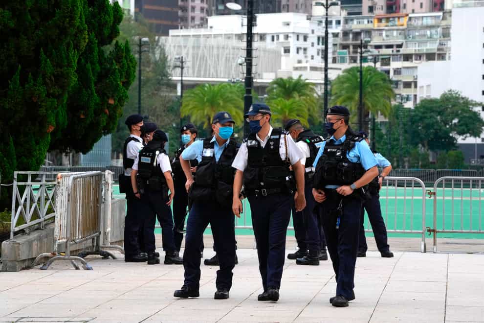 Police officers stand guard at the Hong Kong’s Victoria Park (Kin Cheung/AP)