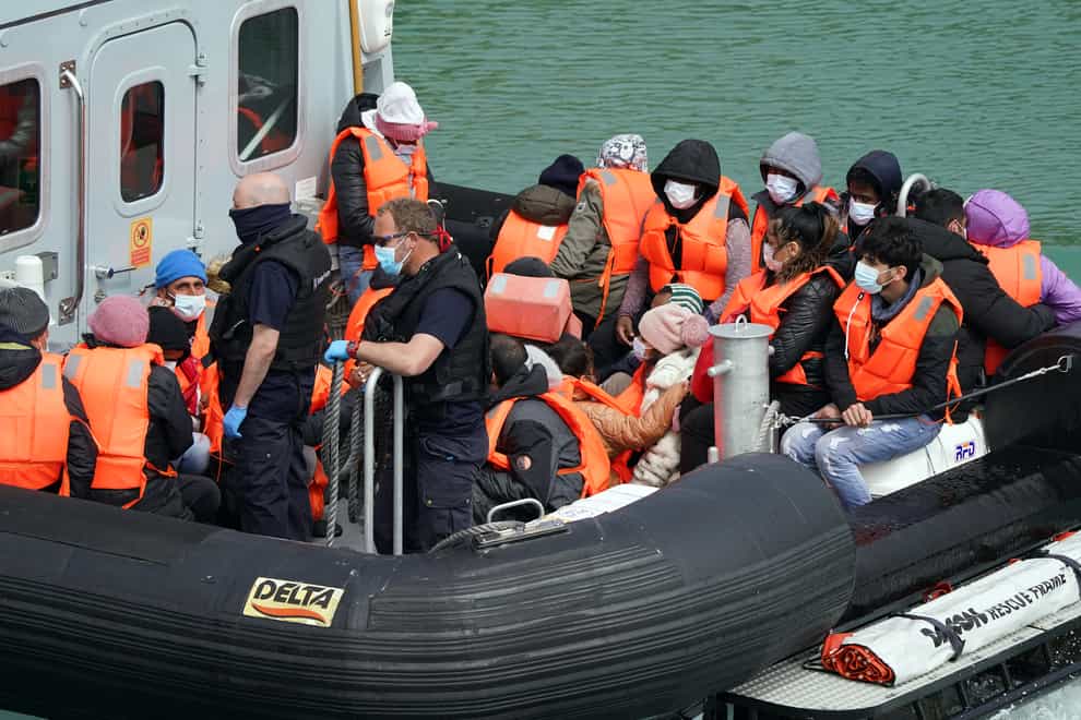 File image of a group of people thought to be migrants are brought in to Dover, Kent, by Border Force officers (Gareth Fuller/PA)