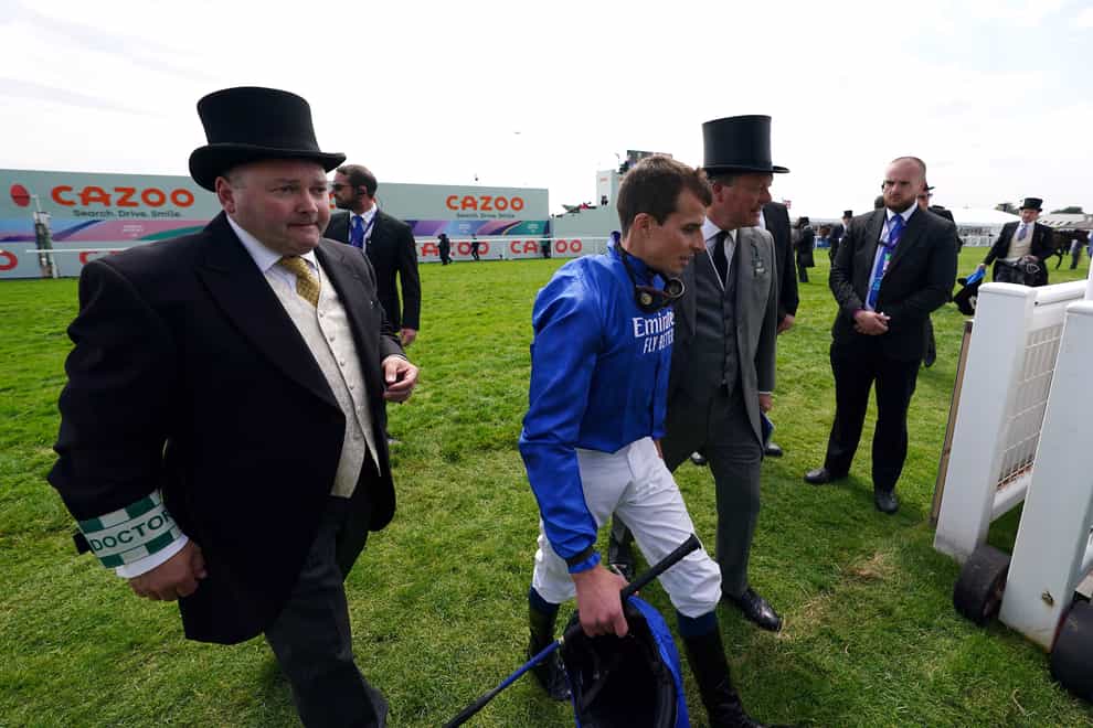 William Buick walks back in after being left in the starting stalls in the Cazoo Handicap (David Davies/PA)