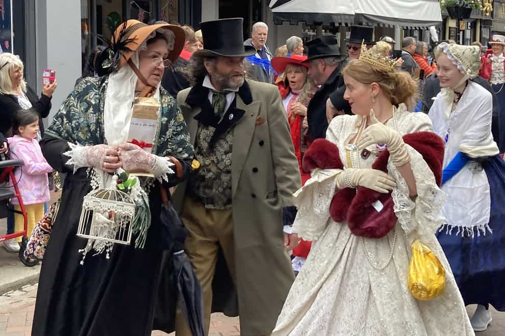 People dressed as Dickensian literary characters take part in parade at the Platinum Jubilee Dickens Festival in Rochester (Katie Boyden/PA)