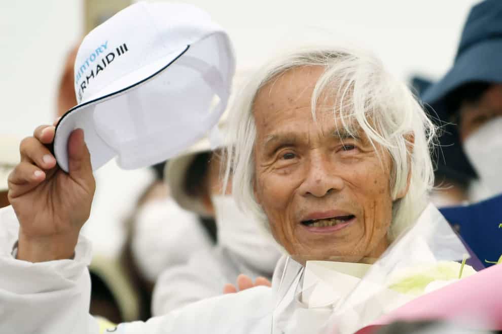 Japanese octogenarian adventurer Kenichi Horie arrives in Nishinomiya after completing his solo non-stop voyage across the Pacific in 69 days (Kosuke Moriwaki/Kyodo News/AP)