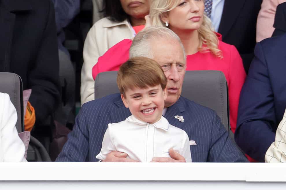 Prince Louis sits on his the Prince of Wales’ lap (Chris Jackson/PA)