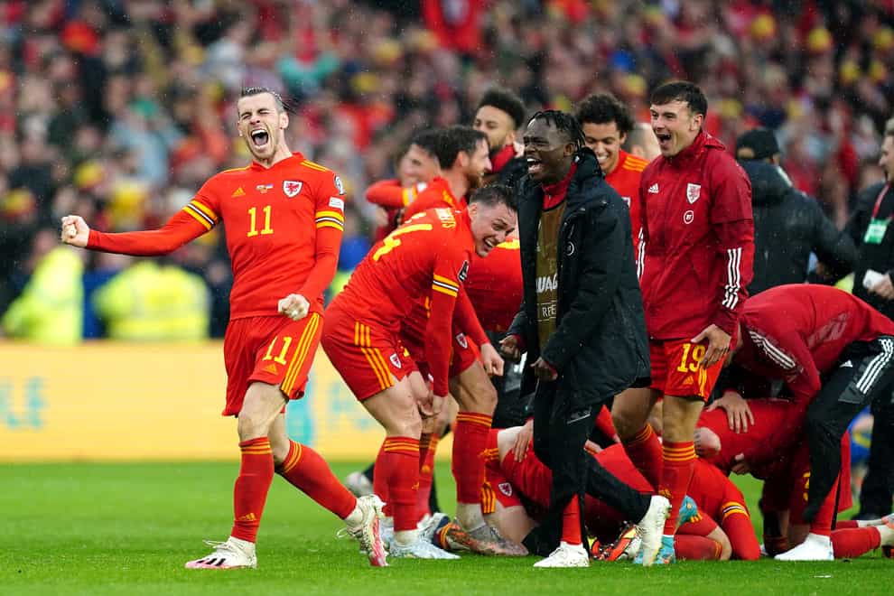Gareth Bale, left, and Wales celebrate qualifying for the World Cup (David Davies/PA)