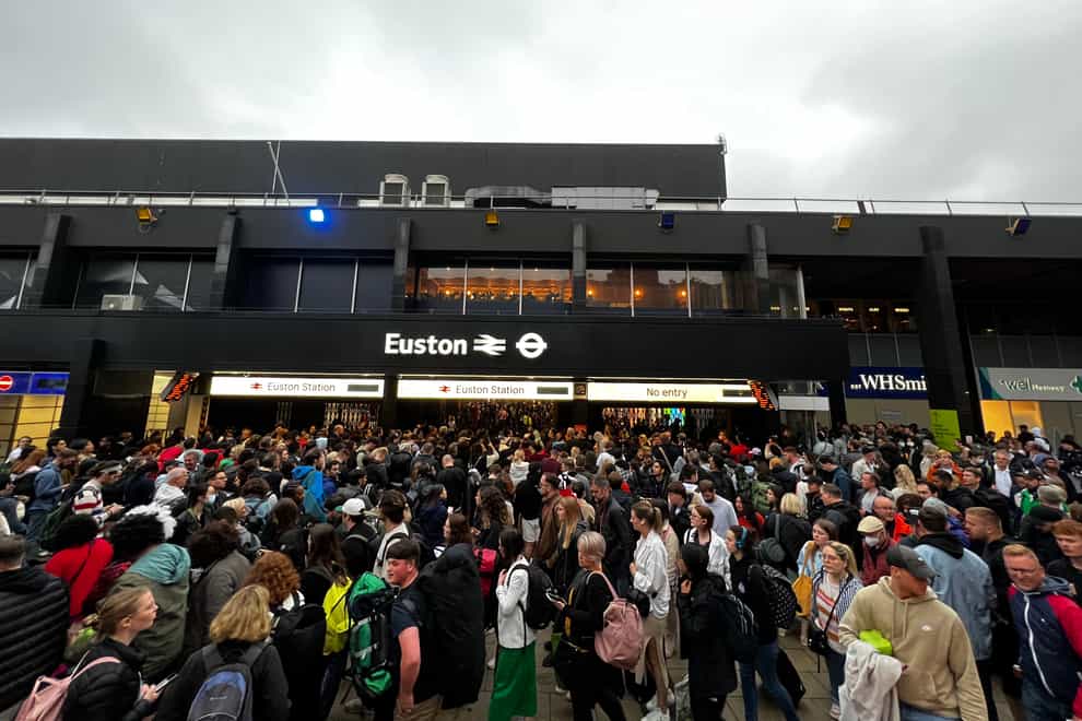 Queues are seen outside London Euston station on Sunday (Joao Souza/PA)
