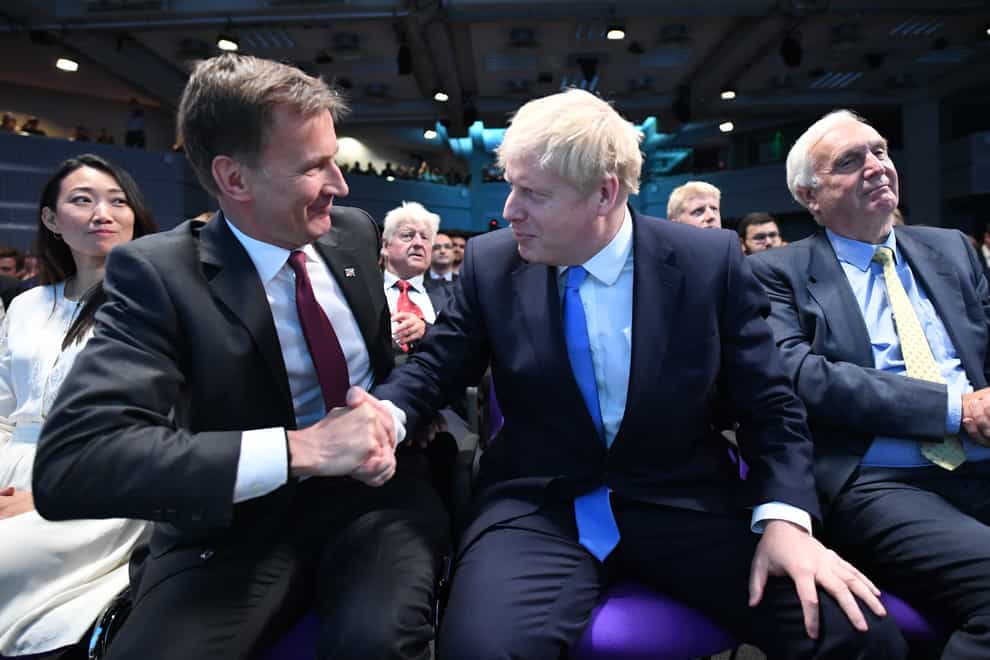 Jeremy Hunt (second left) congratulates Boris Johnson (second right) at the Queen Elizabeth II Centre in London where he was announced as the new Conservative party leader, and will become the next Prime Minister.
