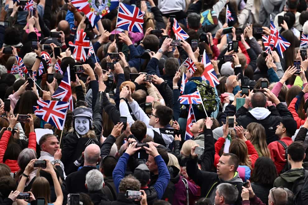 The crowd during the Platinum Jubilee Pageant in front of Buckingham Palace on Sunday. Last week saw the busiest Wednesday for cash machine withdrawals since before the coronavirus pandemic, although Sunday was quieter for withdrawals than expected, according to ATM network Link (Ben Stansall/PA)