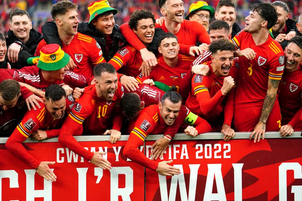 Wales celebrate reaching the World Cup (David Davies/PA)