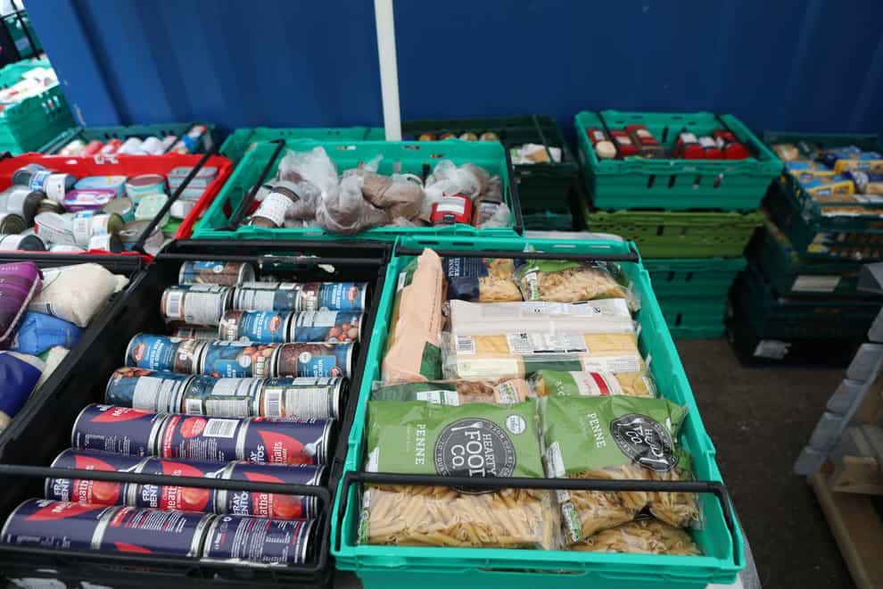 Food laid out in crates at a food bank in north London (PA)