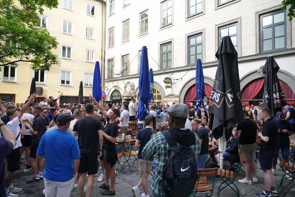 England football fans gather outside Kilians Irish Pub in Frauenplatz square in Munich (Yui Mok/PA)
