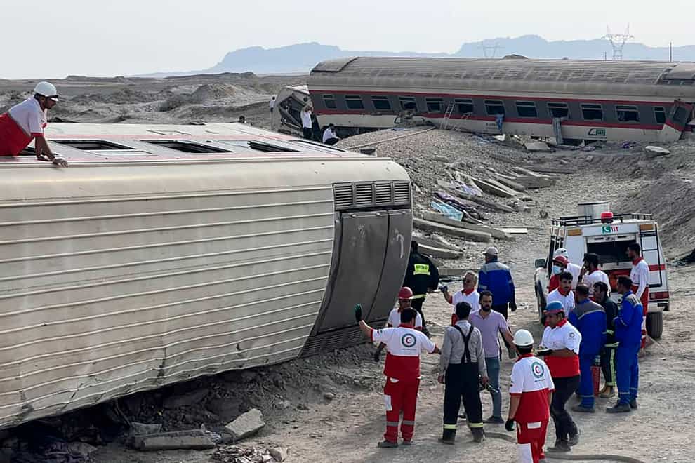 Rescuers work at the scene (Iranian Red Crescent Society via AP)