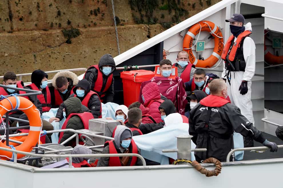 A group of people thought to be migrants are brought in to Dover, Kent, onboard a Border Force vessel following a small boat incident in the Channel. Picture date: Tuesday June 7, 2022.