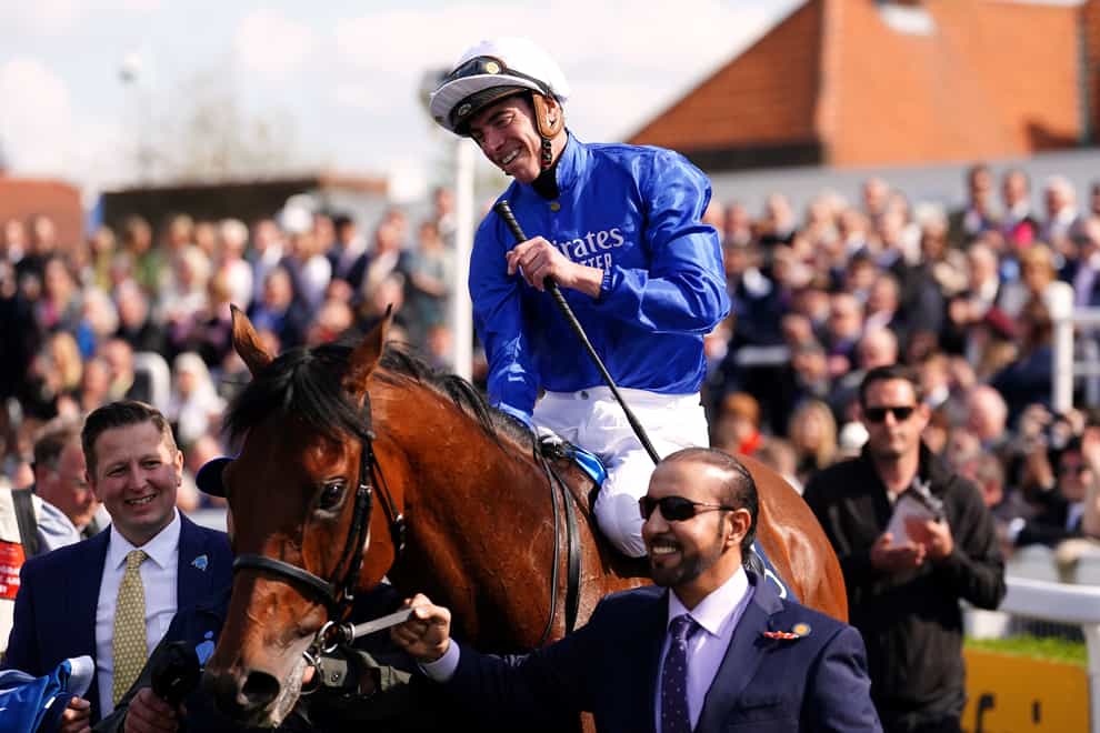Jockey James Doyle celebrates after winning the Qipco 2000 Guineas Stakes with Coroebus on day two of the QIPCO Guineas Festival at Newmarket Racecourse, Newmarket. Picture date: Saturday April 30, 2022.