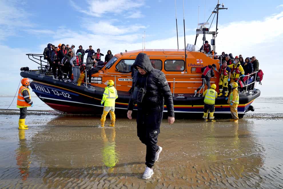A group of people thought to be migrants are brought in to Dungeness, Kent, onboard the RNLI Dungeness Lifeboat, following a small boat incident in the Channel. Picture date: Tuesday May 17, 2022. (Gareth Fuller/PA)