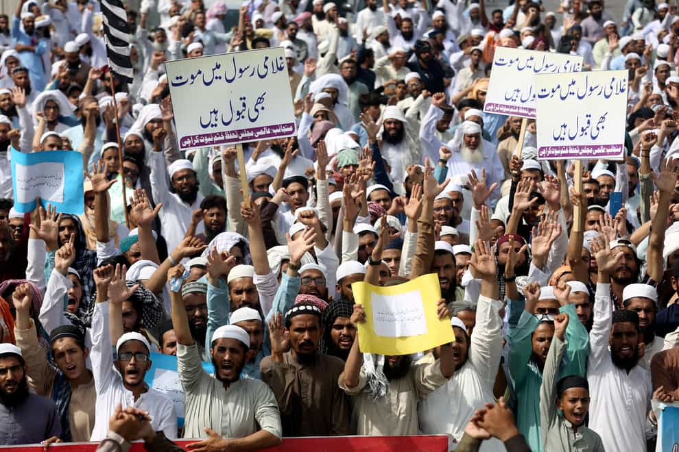 Supporters of a Pakistani religious group demonstrate to condemn derogatory references to Islam (Fareed Khan/AP)