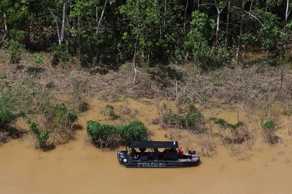 Police investigating the disappearance of a British journalist and Indigenous official in the Amazon have said they are analysing human matter found in the Itaquai River, near Atalaia do Norte’s port (Edmar Barros/AP)