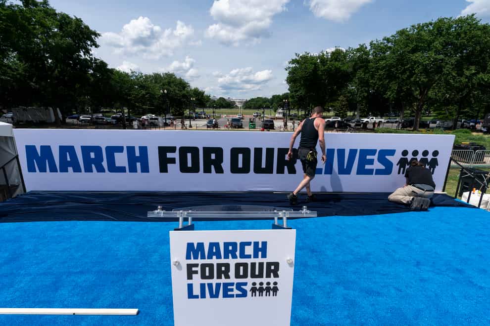 Workers set up for the March For Our Lives rally on the National Mall, near the White House (Alex Brandon/AP)