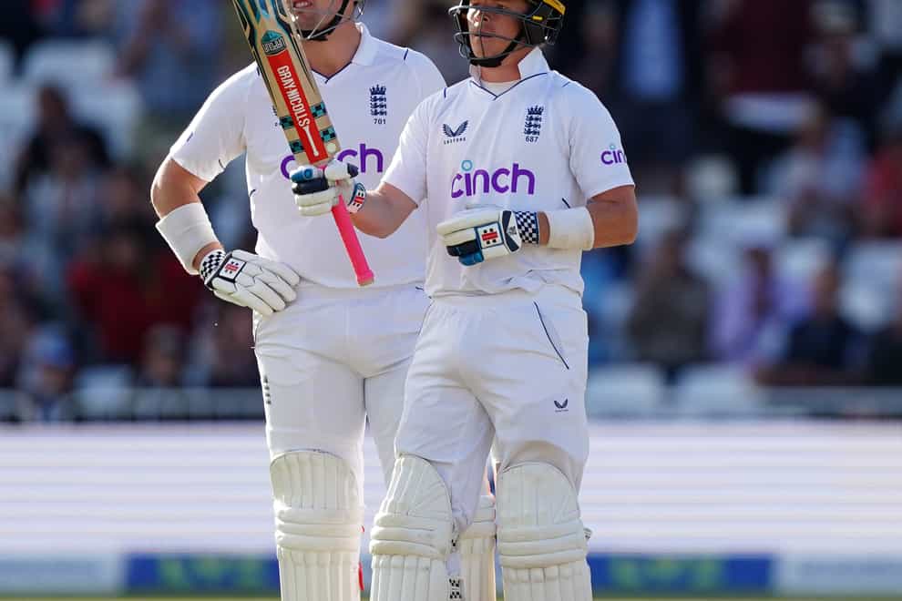 England’s Ollie Pope (right) celebrates his half-century (Mike Egerton/PA).