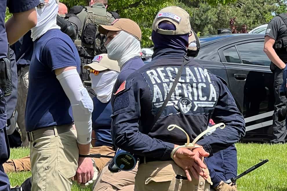 Authorities arrest members of the white supremacist group Patriot Front near an Idaho pride event (Georji Brown/AP)