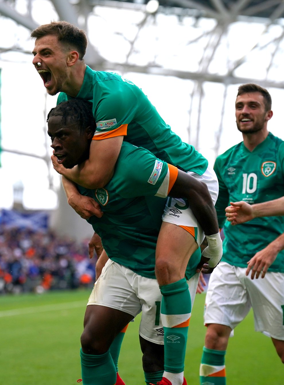 Republic of Ireland striker Michael Obafemi (left) celebrates with his team-mates after his stunning strike against Scotland (Niall Carson/PA)