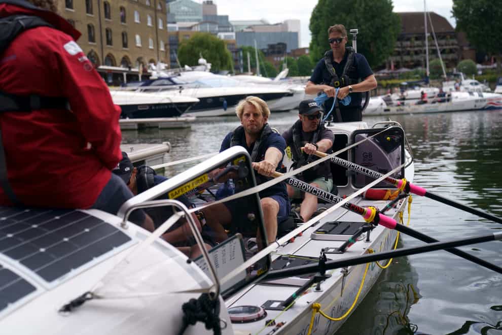 Crew from team Albatross, including Olympic rower Andrew Triggs Hodge, centre, leave the GB Row Challenge start point at St Katharine Docks in central London (Victoria Jones/PA)