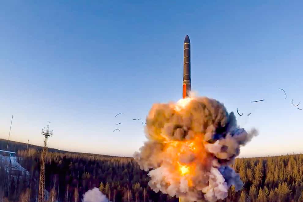 A rocket launches from missile system as part of a ground-based intercontinental ballistic missile test launched from the Plesetsk facility in north-west Russia (Russian Defense Ministry Press Service/AP)