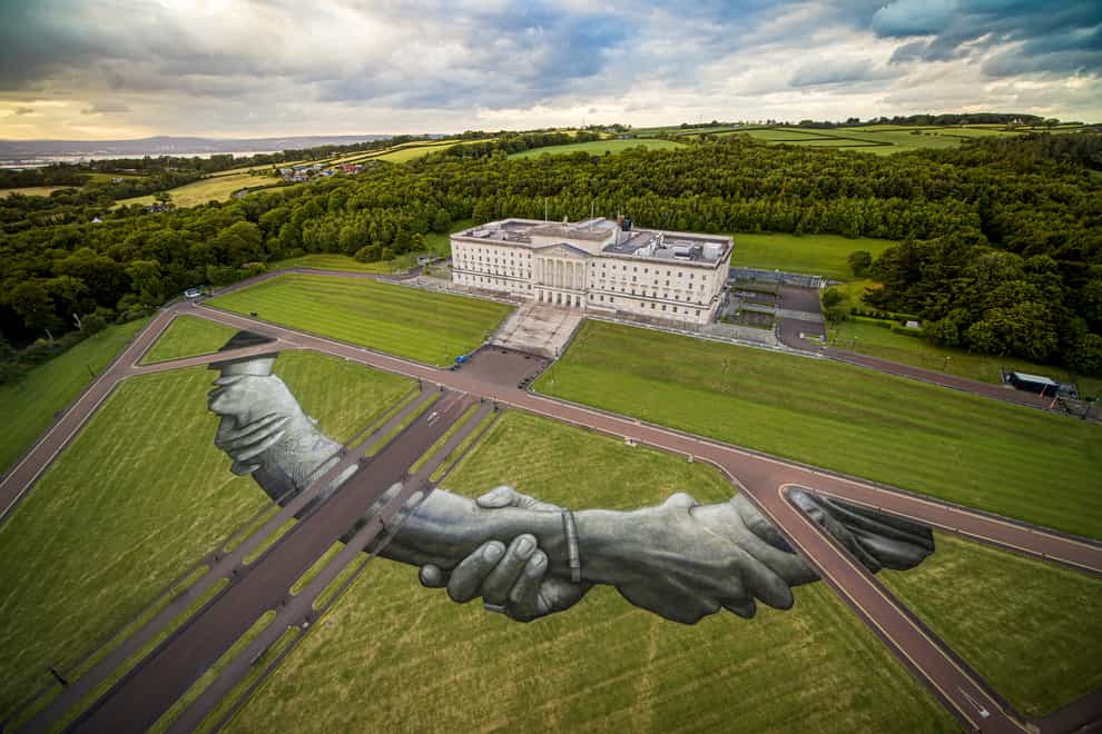 A giant biodegradable land art painting by French-Swiss artist Saype in the grounds of Stormont (Saype)