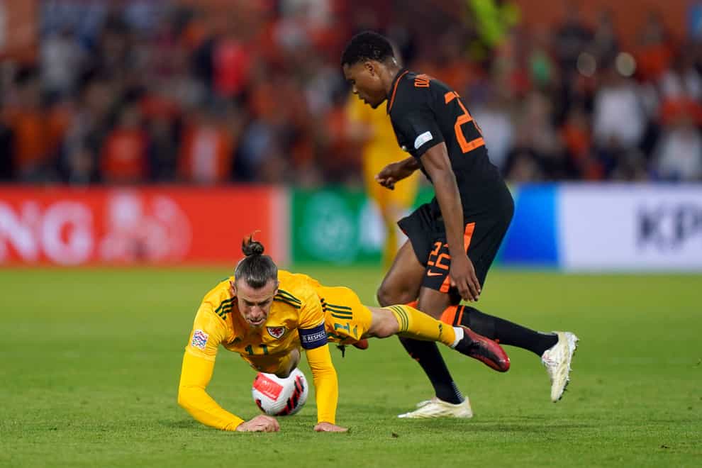 Gareth Bale is grounded by Denzel Dumfries during Wales’ 3-2 defeat to Holland (Tim Goode/PA)