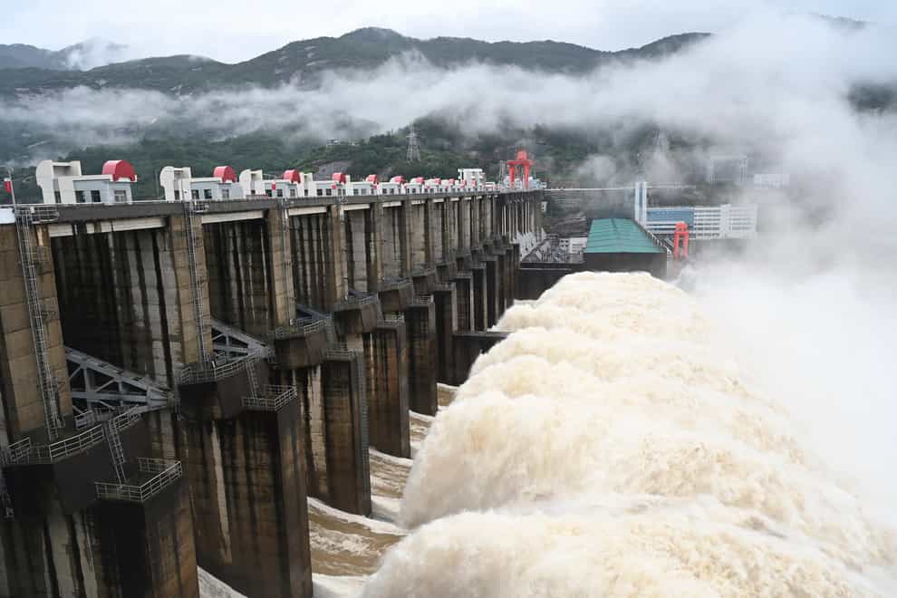 Water flows out from a gate of the Shuikou Hydropower Station in south-east China’s Fujian Province (Lin Shanchuan/Xinhua/AP)