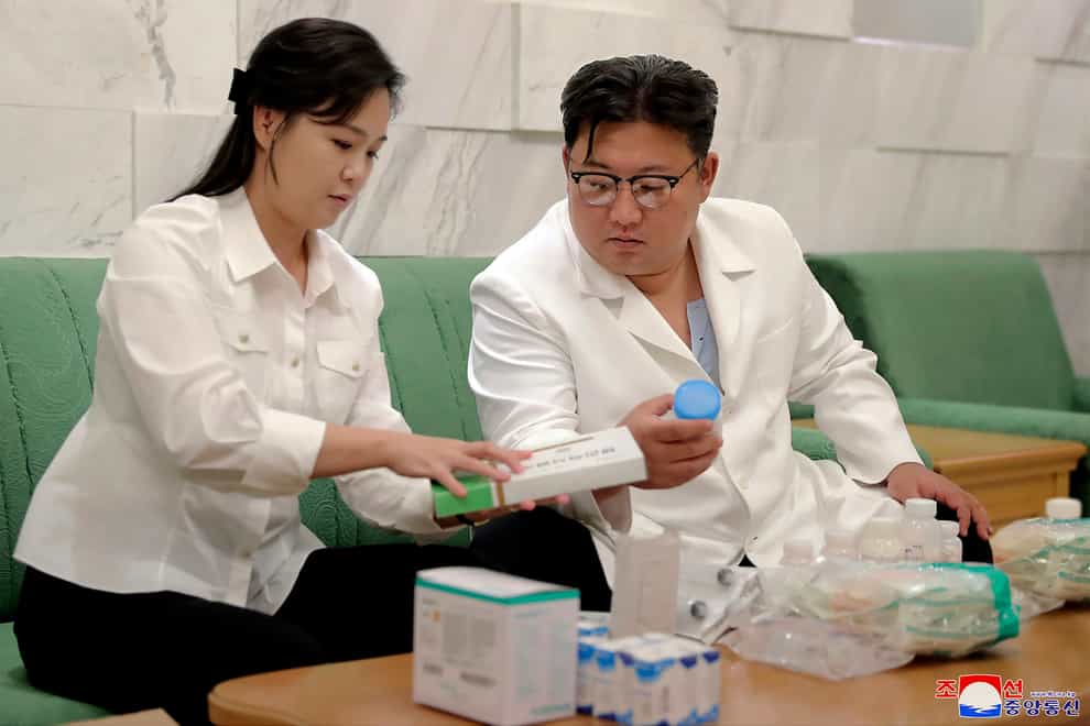 North Korean leader Kim Jong Un and his wife Ri Sol Ju prepare medicines (Korean Central News Agency/Korea News Service/AP)