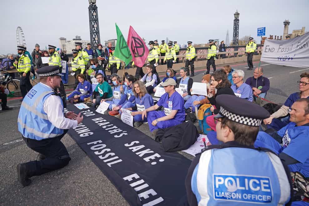 Extinction Rebellion protesters block Lambeth Bridge, central London (Yui Mok/PA)