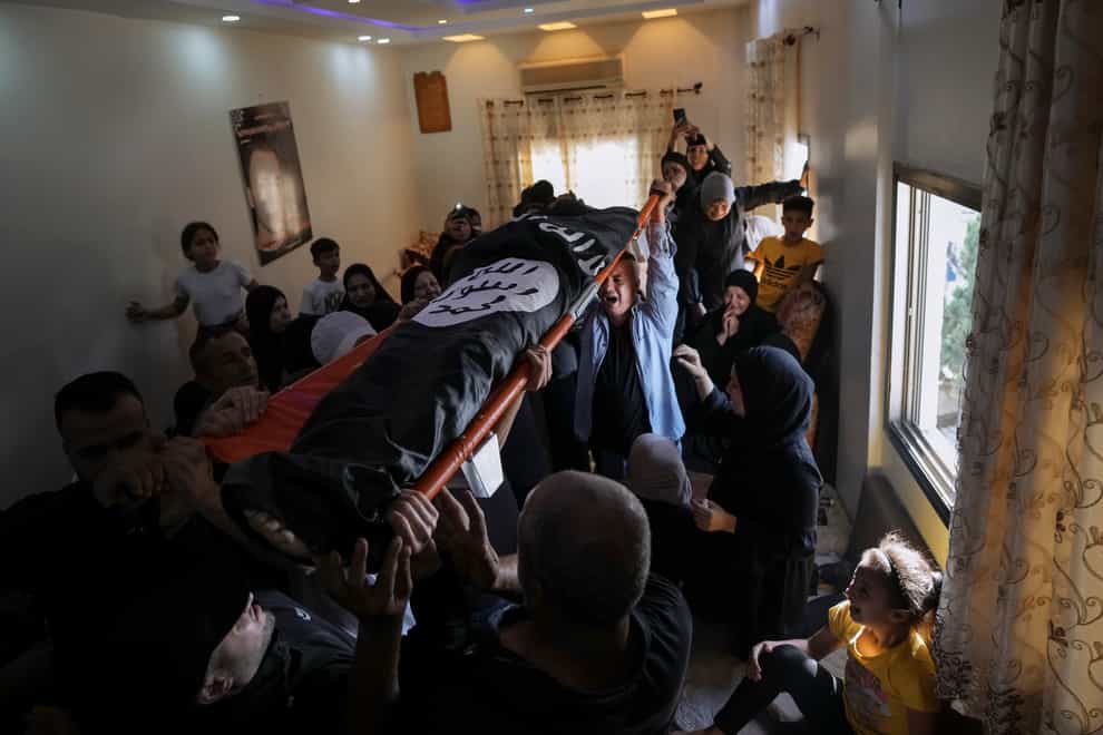 Mourners carry the body of Bara Lahlouh, 24, in the West Bank town of Jenin (AP Photo/Nasser Nasser)
