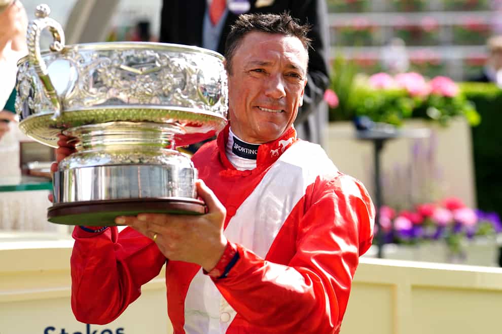 Jockey Frankie Dettori celebrates with the trophy after winning the Coronation Stakes with Inspiral during day four of Royal Ascot at Ascot Racecourse (David Davies/PA)