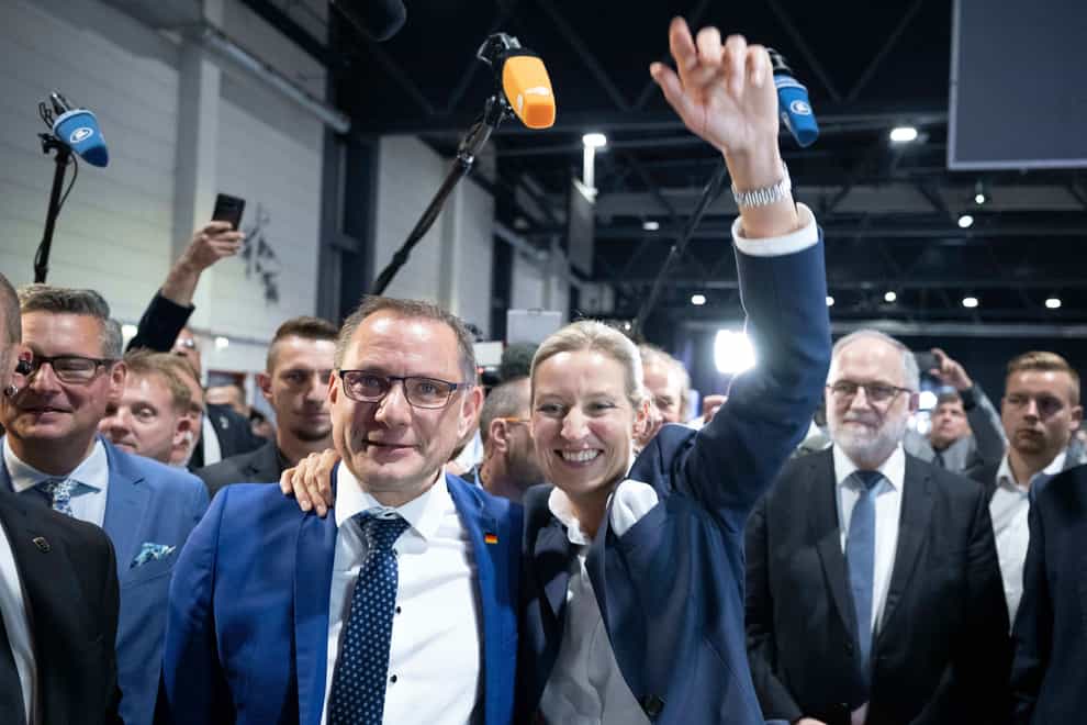 Tino Chrupalla, congratulates Alice Weidel at the AfD’s federal party conference following her election as the party’s co-leader (dpa via AP)
