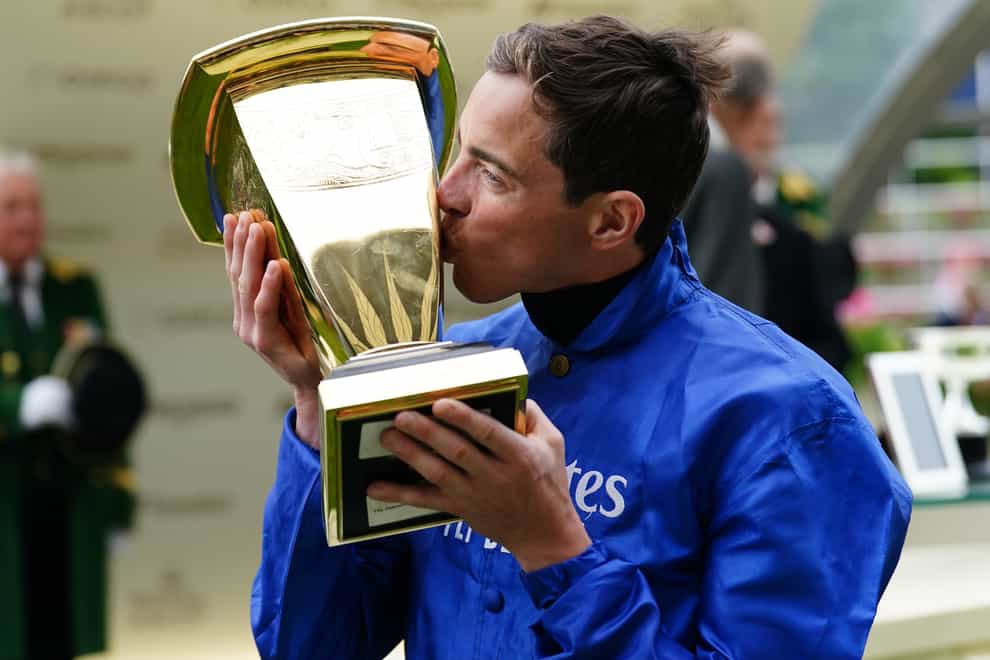 Jockey James Doyle with the trophy after winning the Platinum Jubilee Stakes on Naval Crown (David Davies/PA)