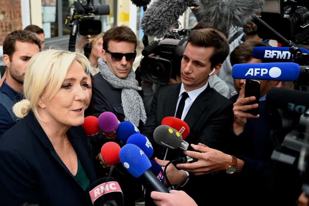French far-right leader Marine Le Pen addresses reporters in Henin-Beaumont, northern France (AP)