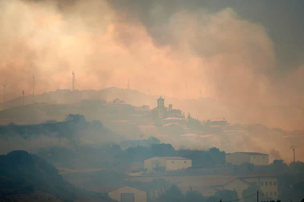 Smoke rises over San Martin de Unx in northern Spain (Miguel Oses/AP)