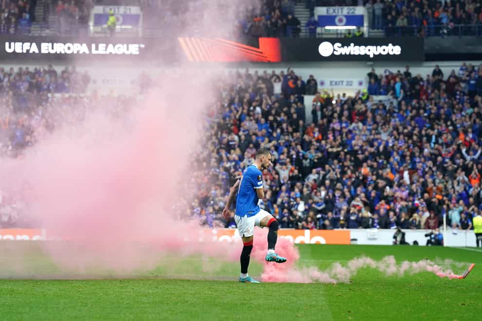 A flare was thrown on the pitch during Rangers’ clash with RB Leipzig (Andrew Milligan/PA)