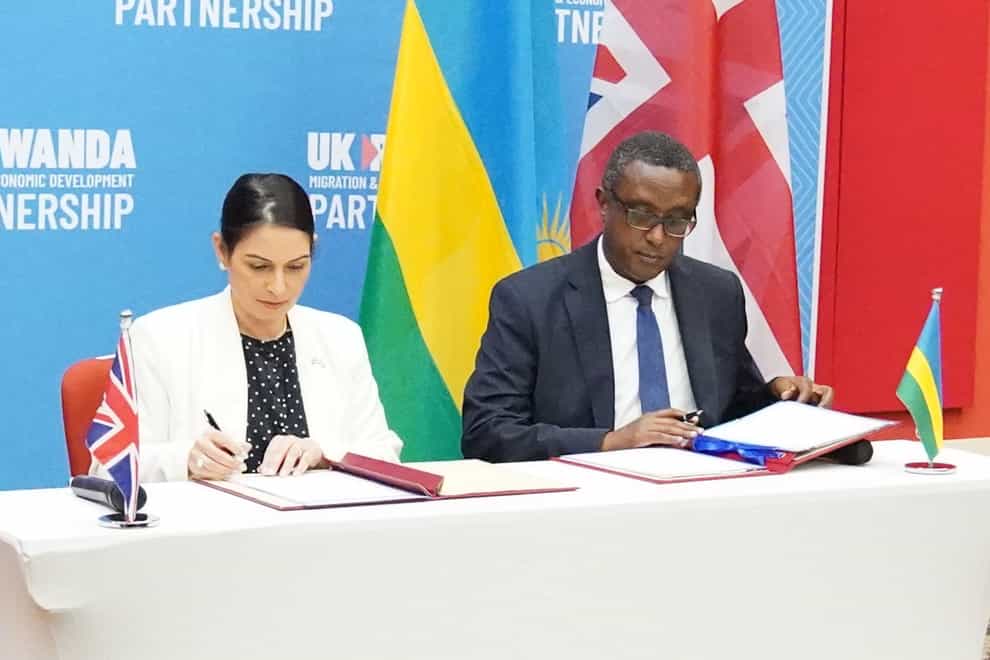 Home Secretary Priti Patel and Rwandan minister for foreign affairs Vincent Biruta, sign a migration and economic development partnership (Flora Thompson/PA)