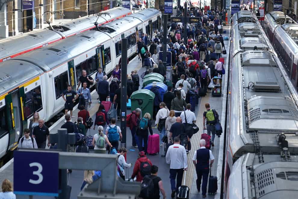 Passengers at London King’s Cross station (PA)
