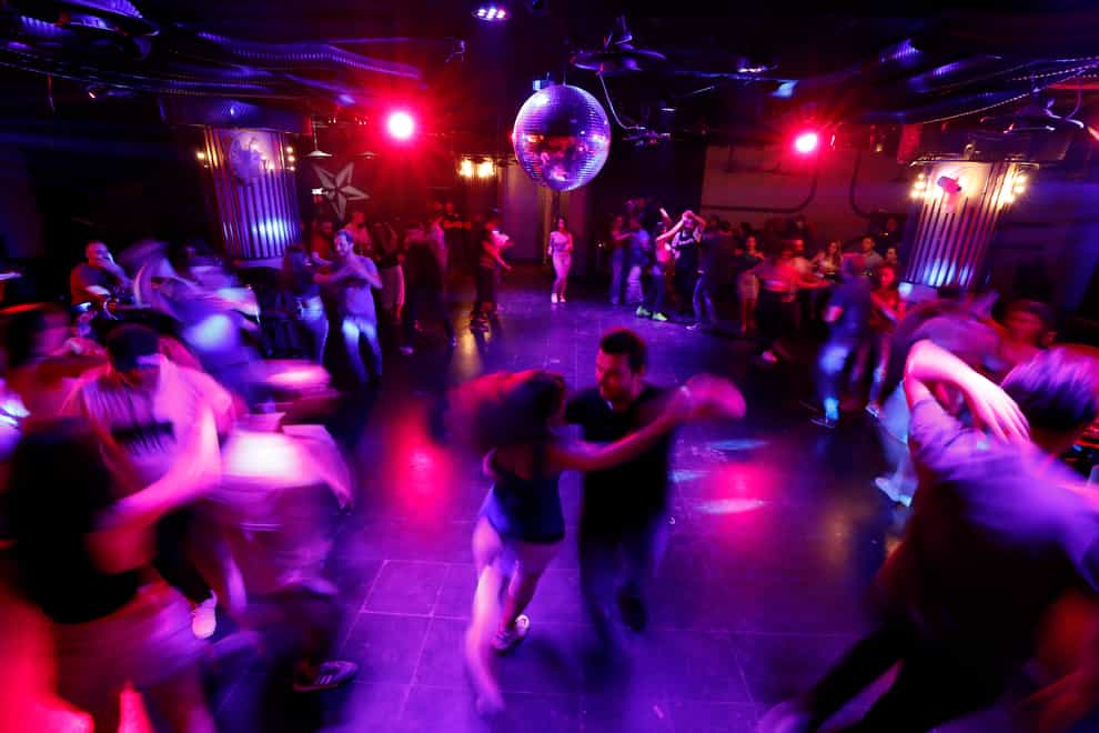 Couples dance at a club in Damascus, Syria (Omar Sanadik/AP)