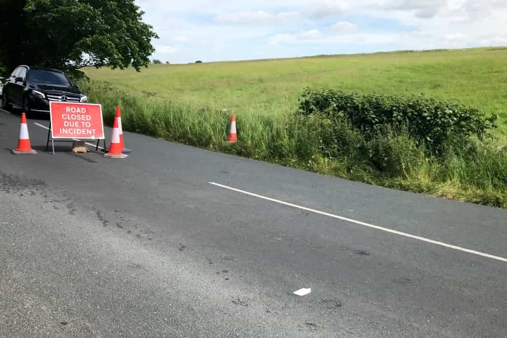 A road closed by police near the scene of a helicopter crash in a field near Burton in Lonsdale, North Yorkshire (Kim Pilling/PA)