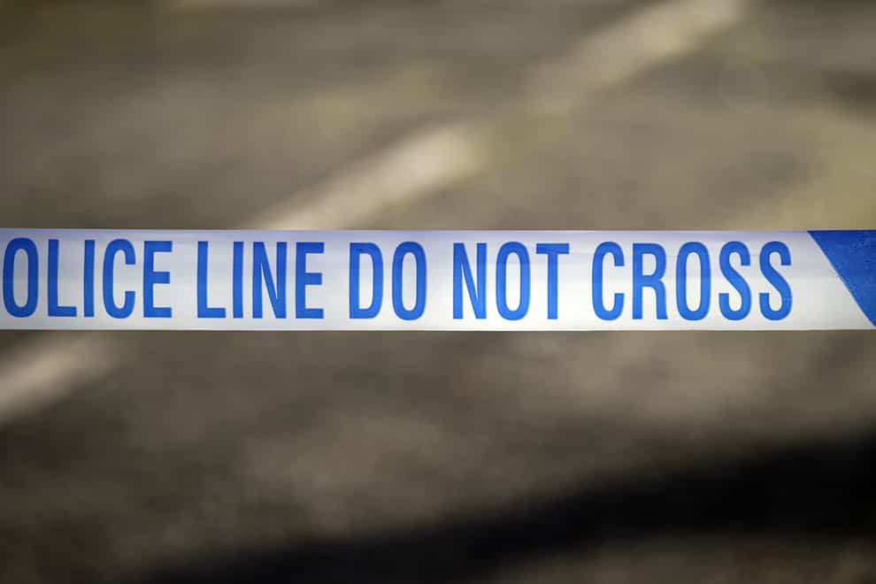 The off-duty officer was stabbed in Esher on Tuesday afternoon, Surrey Police said.