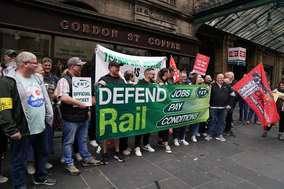 The picket line outside Glasgow Central Station (Andrew Milligan/PA)
