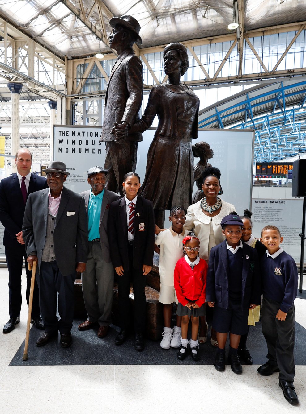 The Duke and Duchess of Cambridge, accompanied by Baroness Floella Benjamin, Windrush passengers Alford Gardner and John Richards and children at the unveiling of the National Windrush Monument at Waterloo Station, to mark Windrush Day (John Sibley/PA)