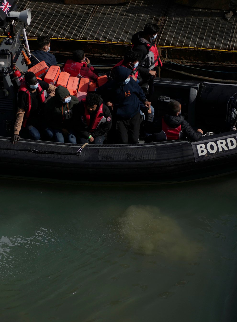 Men thought to be migrants who undertook the crossing from France in small boats and were picked up in the Channel (AP)