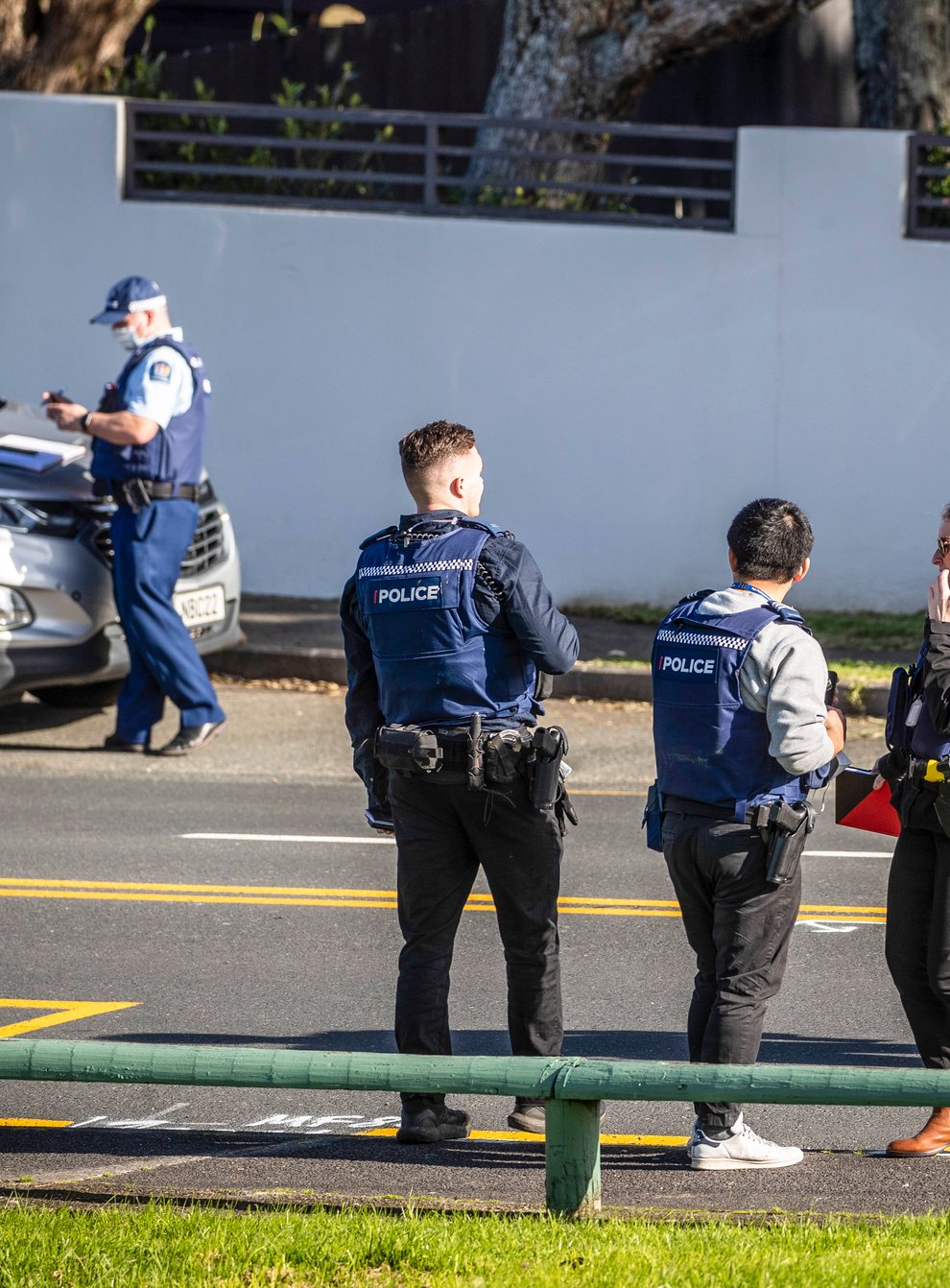 Police set up cordons and search area around a suburb of Auckland following reports of multiple stabbings in New Zealand (Michael Craig/New Zealand Herald/AP)