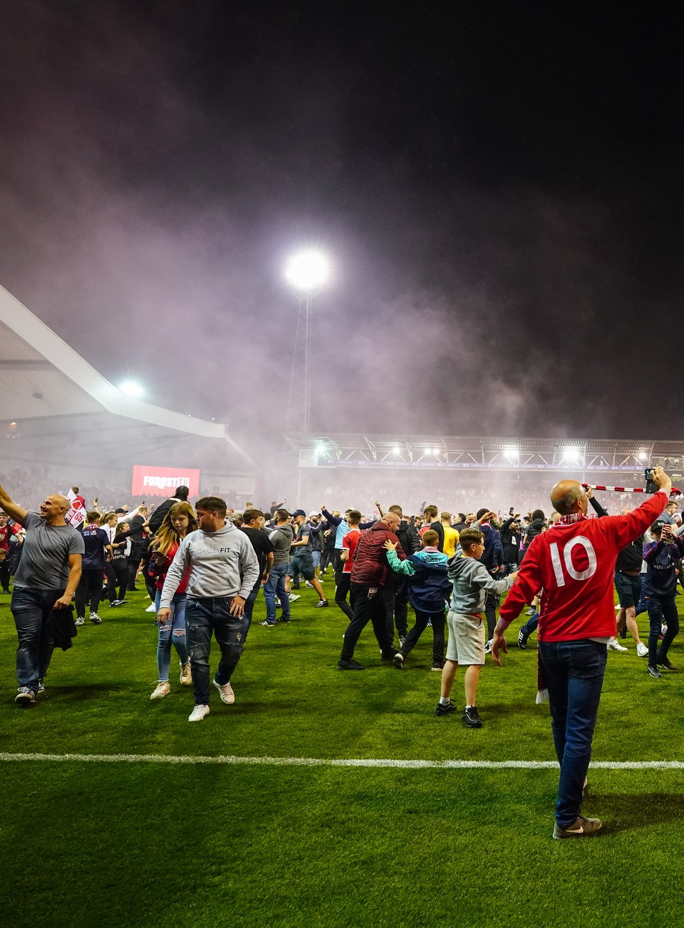 Nottingham Forest fans celebrate on the pitch after they reach the play off final during the Sky Bet Championship play-off semi-final, second leg match at the City Ground, Nottingham (Zac Goodwin/PA)