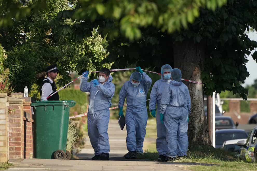 Forensic Officers at the scene in Brookside South, Barnet, north London, after a 37-year-old woman and five-year-old child were found fatally stabbed. The Metropolitan Police said the pair, believed to be mother and son, were pronounced dead at the scene and a 37-year old man, believed to have been known to the victims, has been arrested on suspicion of murder. Picture date: Tuesday June 21, 2022 (Lucas Cumiskey/PA)