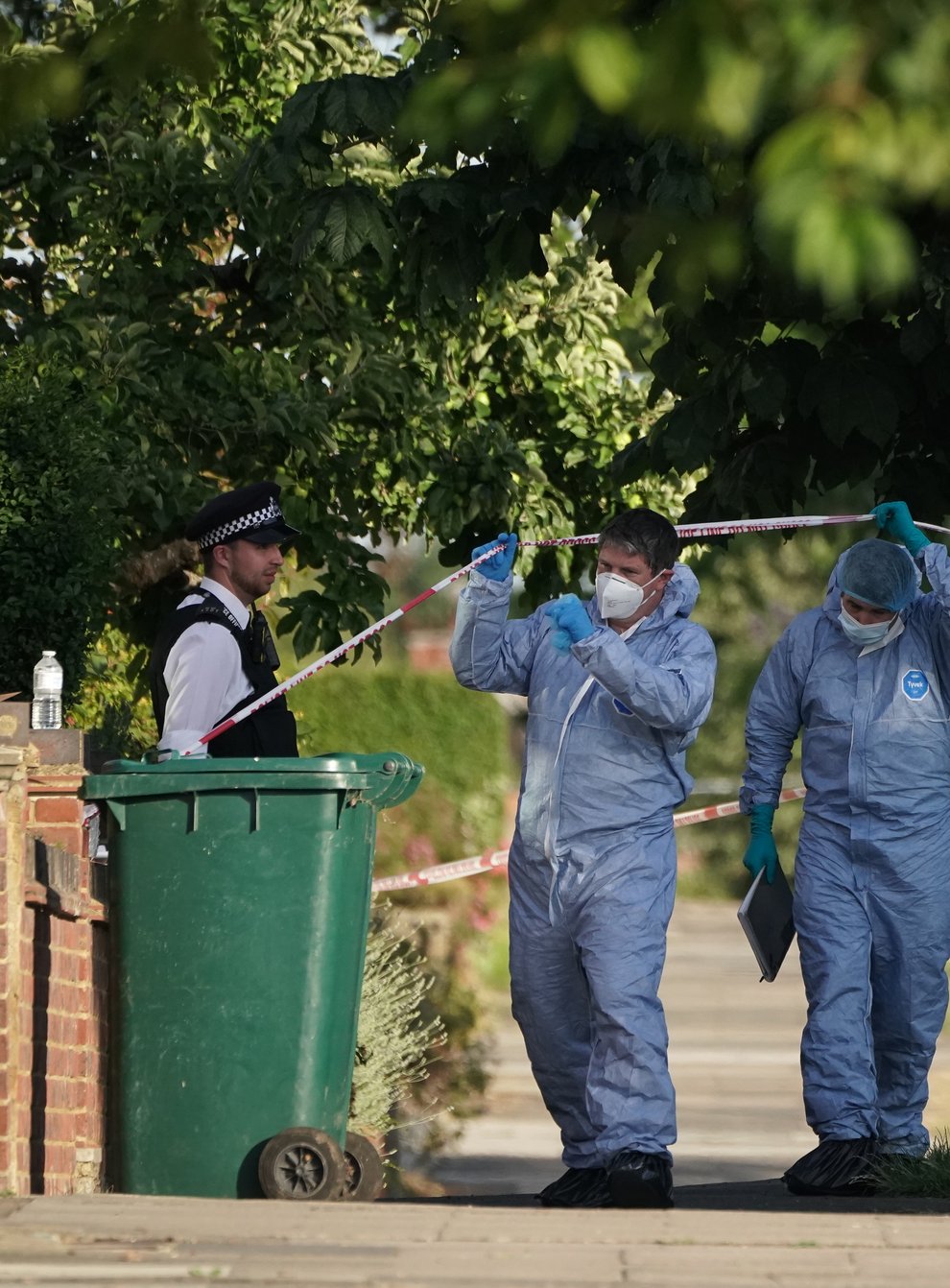 Forensic Officers at the scene in Brookside South, Barnet, north London, after a 37-year-old woman and five-year-old child were found fatally stabbed. The Metropolitan Police said the pair, believed to be mother and son, were pronounced dead at the scene and a 37-year old man, believed to have been known to the victims, has been arrested on suspicion of murder. Picture date: Tuesday June 21, 2022 (Lucas Cumiskey/PA)
