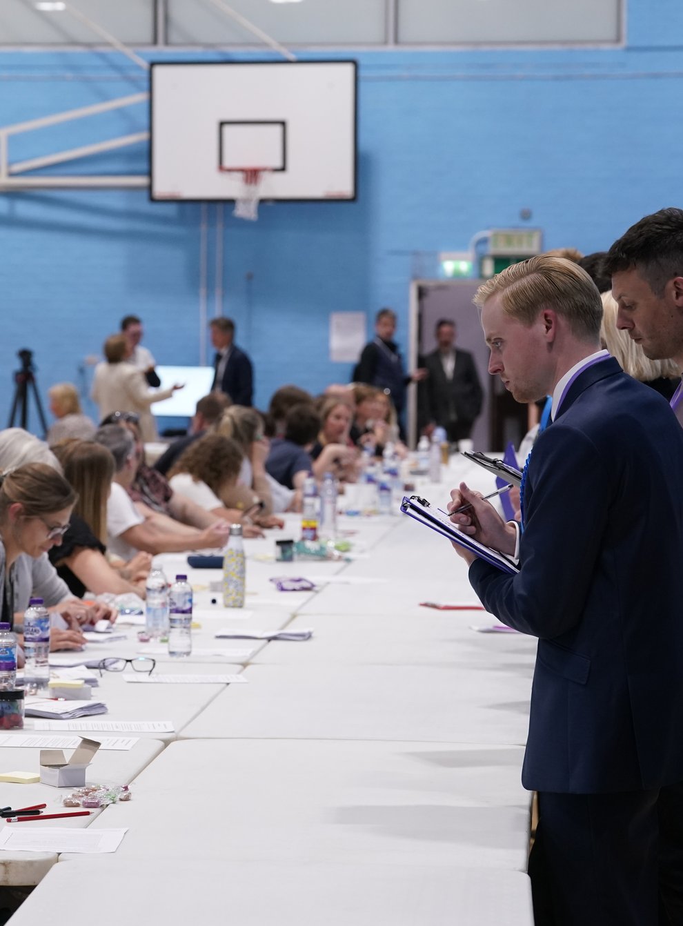Postal votes are counted at the Lords Meadow Leisure Centre, in Crediton, Devon, for the Tiverton and Honiton by-election, which was triggered by the resignation of MP Neil Parish for watching pornography in the Commons. Picture date: Thursday June 23, 2022.